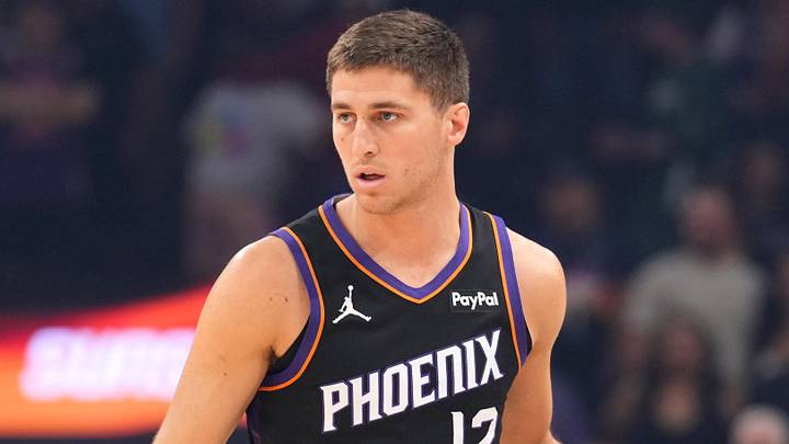 Mar 21, 2026; Phoenix, Arizona, USA; Phoenix Suns guard Collin Gillespie (12) dribbles against the Milwaukee Bucks during the first half at Mortgage Matchup Center. Mandatory Credit: Joe Camporeale-Imagn Images