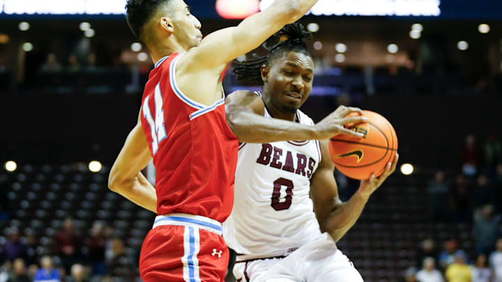 Bradley forward Malevy Leons shuts down Missouri State guard Chance Moore during the Braves 86-62 victory in a Missouri Valley Conference game at Great Southern Bank Arena in Springfield, Mo., on Wednesday, Feb. 21, 2024.