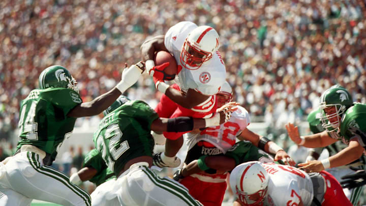 Nebraska Cornhuskers running back Lawrence Phillips (1) dives for a touchdown against the Michigan State Spartans at Spartan Stadium.
