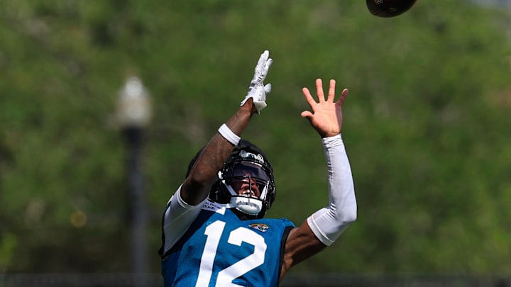 Jacksonville Jaguars wide receiver Travis Hunter (12) catches a pass after an NFL training camp session at the Miller Electric Center, Sunday, Aug. 3, 2025, in Jacksonville, Fla. [Corey Perrine/Florida Times-Union]