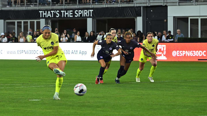 Oct 13, 2024; Washington, District of Columbia, USA; Washington Spirit forward Ashley Hatch (33) scores a goal form a penataly kick in the second half against Racing Louisville FC  at Audi Field. Mandatory Credit: Rafael Suanes-Imagn Images