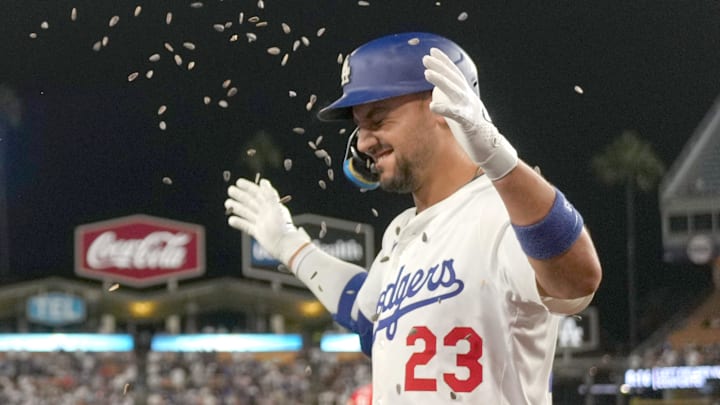 Aug 27, 2025; Los Angeles, California, USA; Los Angeles Dodgers left fielder Michael Conforto (23) is showered with sunflower seeds after hitting a home run in the eighth inning against the Cincinnati Reds at Dodger Stadium. Mandatory Credit: Kirby Lee-Imagn Images Aug 27, 2025; Los Angeles, California, USA; Los Angeles Dodgers left fielder Michael Conforto (23) is showered with sunflower seeds after hitting a home run in the eighth inning against the Cincinnati Reds at Dodger Stadium. Mandatory Credit: Kirby Lee-Imagn Images