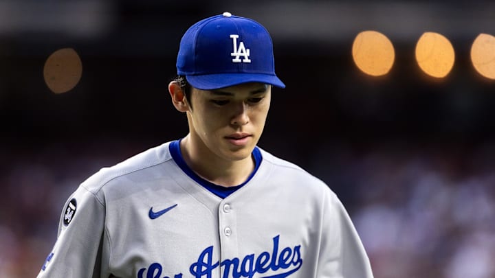 May 9, 2025; Phoenix, Arizona, USA; Los Angeles Dodgers pitcher Roki Sasaki (11) reacts against the Arizona Diamondbacks at Chase Field. Mandatory Credit: Mark J. Rebilas-Imagn Images