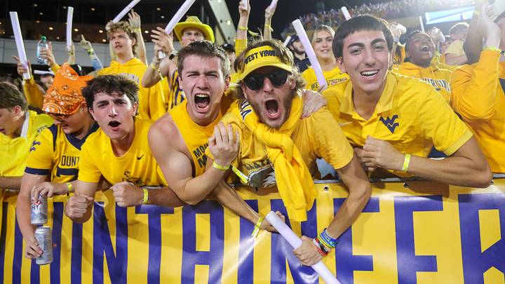 Sep 26, 2026; Morgantown, West Virginia, USA;  West Virginia Mountaineers students cheer after a touchdown during the third quarter against the Oklahoma State Cowboys at Milan Puskar Stadium.  Mandatory Credit: Ben Queen-Imagn Images