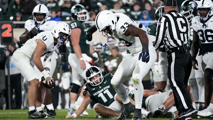 Penn State Nittany Lions defensive end Dani Dennis-Sutton (33) celebrates a sack of Michigan State Spartans quarterback Alessio Milivojevic (11) in the fourth quarter at Spartan Stadium.