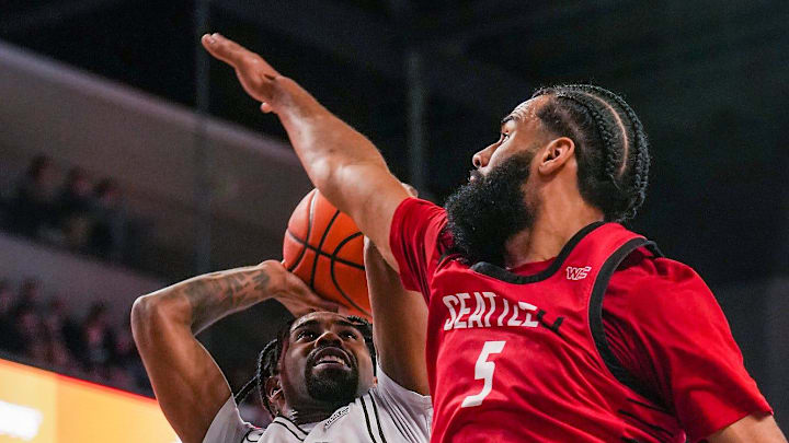 Grand Canyon Antelopes guard Jovan Blacksher Jr. (10), left, attempt a lay up while guarded by Seattle's Cameron Tyson. 