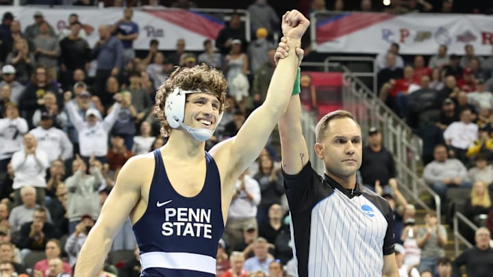 Penn State's Levi Haines has his hand raised after winning the 2024 NCAA Wrestling title.