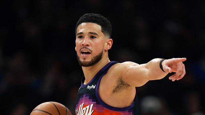 Jan 9, 2026; Phoenix, Arizona, USA; Phoenix Suns guard Devin Booker (1) reacts against the New York Knicks at Mortgage Matchup Center. Mandatory Credit: Mark J. Rebilas-Imagn Images
