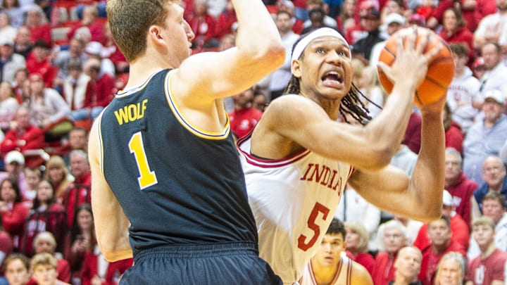 Indiana's Malik Reneau (5) looks to shoot over Michigan's Danny Wolf (1) during the Indiana versus Michigan mens basketball game at Simon Skjodt Assembly Hall on Saturday, Feb. 8, 2025.