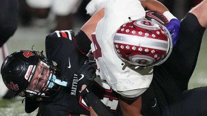 Oak Ridge's Wayne Gibson (4) is brought down by Maryville's Wyatt Wilber (44) in a TSSAA high school football game on October 30, 2025, in Maryville, Tenn. Oak Ridge's Wayne Gibson (4) is brought down by Maryville's Wyatt Wilber (44) in a TSSAA high school football game on October 30, 2025, in Maryville, Tenn.