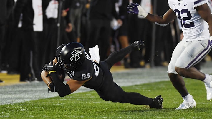 Iowa State Cyclones tight end DeShawn Hanika (83) catches the ball around Kansas State Wildcats linebacker Desmond Purnell (32) during the first quarter at Jack Trice Stadium Saturday, Oct. 8, 2022, in Ames, Iowa.