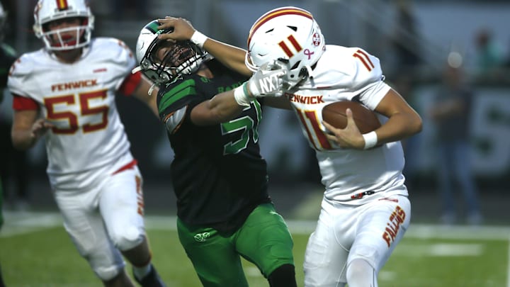 Badin tries to bring down Fenwick sophomore quarterback as Badin defeated Fenwick 41-13 in high school football Oct. 3, 2025, in Hamilton, Ohio