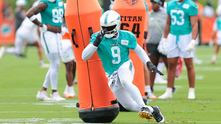 Miami Dolphins edge Josh Uche (9) works during practice at the Baptist Health Training Complex. Miami Dolphins edge Josh Uche (9) works during practice at the Baptist Health Training Complex.