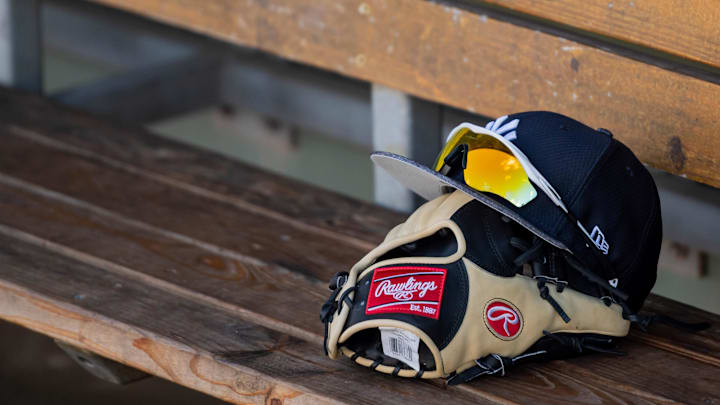 Feb 23, 2019; Fort Myers, FL, USA; General view of a New York Yankees baseball glove and hat in the dugout prior to the game between the Boston Red Sox and the New York Yankees at JetBlue Park. Mandatory Credit: Douglas DeFelice-Imagn Images Feb 23, 2019; Fort Myers, FL, USA; General view of a New York Yankees baseball glove and hat in the dugout prior to the game between the Boston Red Sox and the New York Yankees at JetBlue Park. Mandatory Credit: Douglas DeFelice-Imagn Images