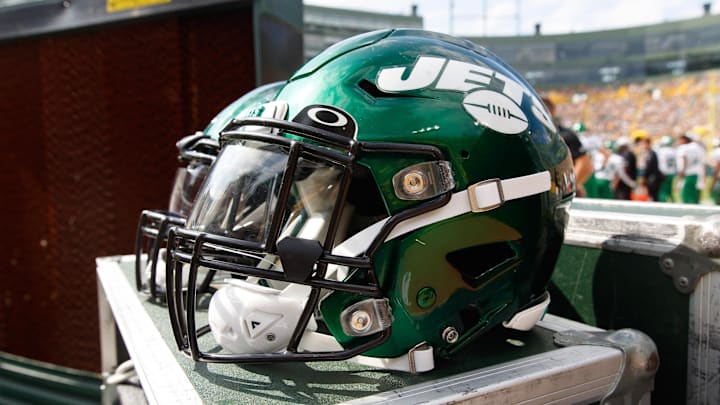 Aug 21, 2021; Green Bay, Wisconsin, USA;  New York Jets helmets sit on the sidelines during the game against the Green Bay Packers at Lambeau Field. Mandatory Credit: Jeff Hanisch-Imagn Images