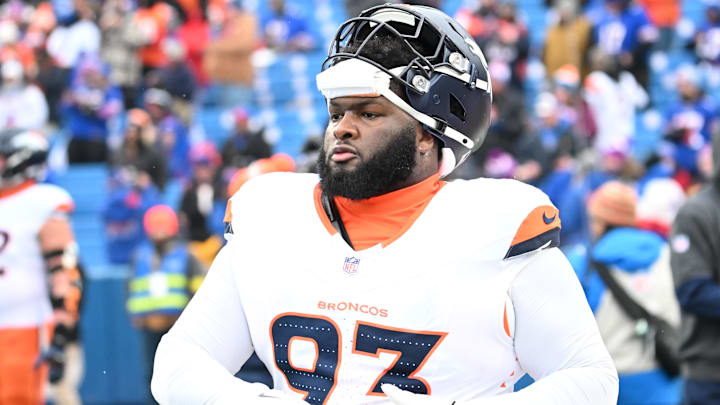 Jan 12, 2025; Orchard Park, New York, USA; Denver Broncos defensive tackle D.J. Jones (93) warms up before a game against the Buffalo Bills in an AFC wild card game at Highmark Stadium. 