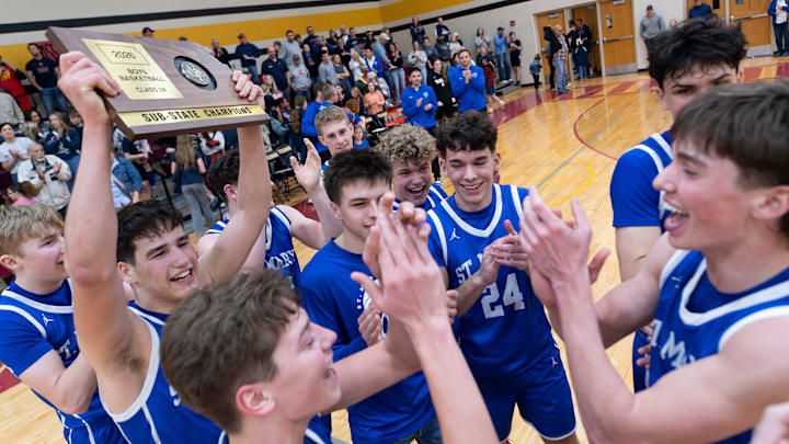 St. Marys celebrates with the championship trophy during 2A Sub-State basketball Saturday, Mar. 7, 2026 at Mission Valley High School.