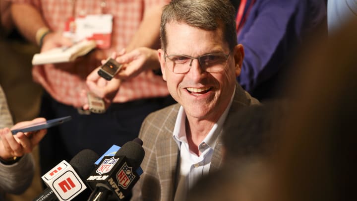 Mar 25, 2024; Orlando, FL, USA;  Los Angeles Chargers head coach Jim Harbaugh talks to media.