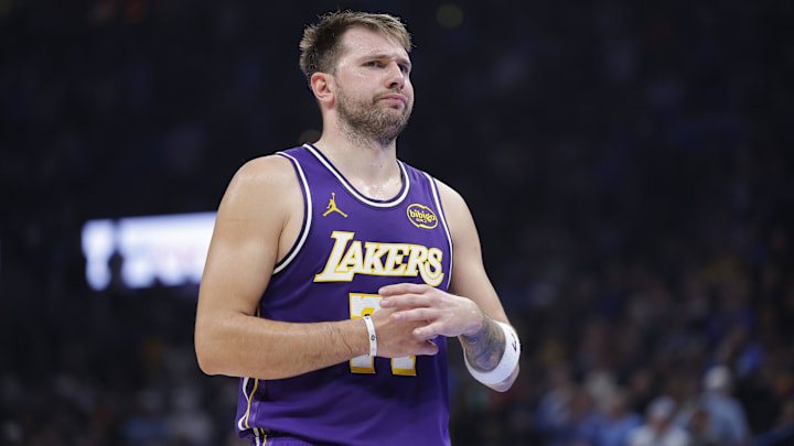 Nov 12, 2025; Oklahoma City, Oklahoma, USA; Los Angeles Lakers guard Luka Doncic reacts to a fan during the second quarter of a game against the Oklahoma City Thunder at Paycom Center.