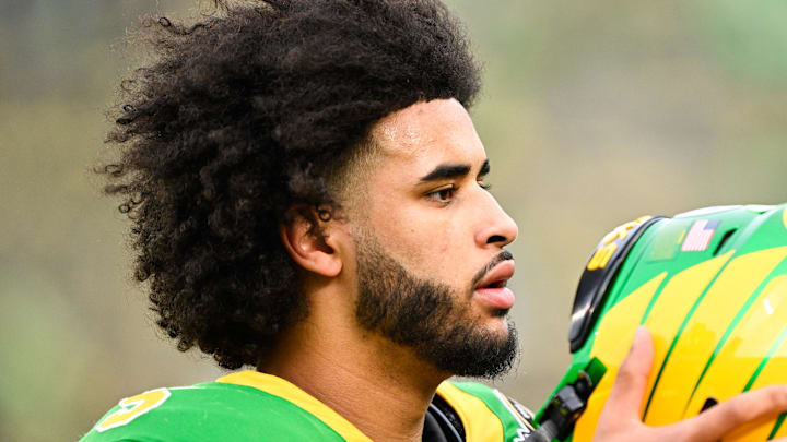Dec 20, 2025; Eugene, OR, USA; Oregon Ducks quarterback Dante Moore (5) looks on before the game against the James Madison Dukes at Autzen Stadium. Mandatory Credit: Troy Wayrynen-Imagn Images