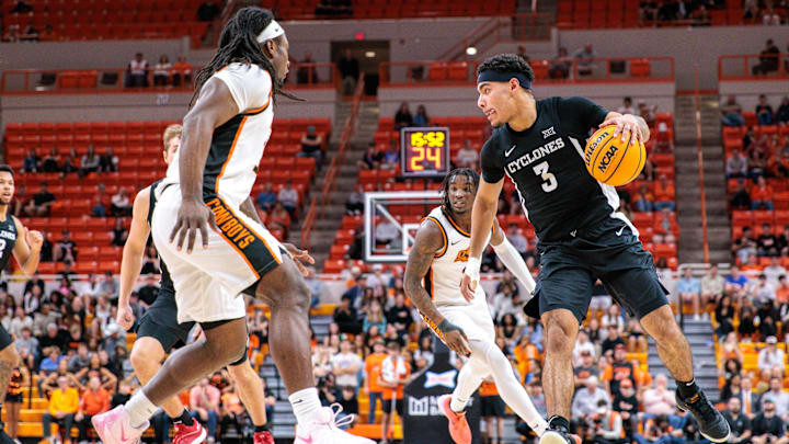 Feb 25, 2025; Stillwater, Oklahoma, USA; Iowa State Cyclones guard Tamin Lipsey (3) drives around Oklahoma State Cowboys guard Connor Dow (13) during the second half at Gallagher-Iba Arena.