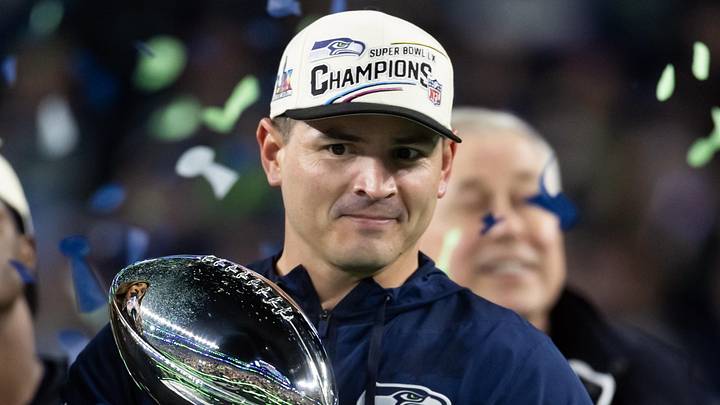 Feb 8, 2026; Santa Clara, CA, USA; Seattle Seahawks head coach Mike MacDonald celebrates with the Vince Lombardi trophy on the podium after defeating the New England Patriots in Super Bowl LX at Levi's Stadium. Mandatory Credit: Mark J. Rebilas-Imagn Images Feb 8, 2026; Santa Clara, CA, USA; Seattle Seahawks head coach Mike MacDonald celebrates with the Vince Lombardi trophy on the podium after defeating the New England Patriots in Super Bowl LX at Levi's Stadium. Mandatory Credit: Mark J. Rebilas-Imagn Images