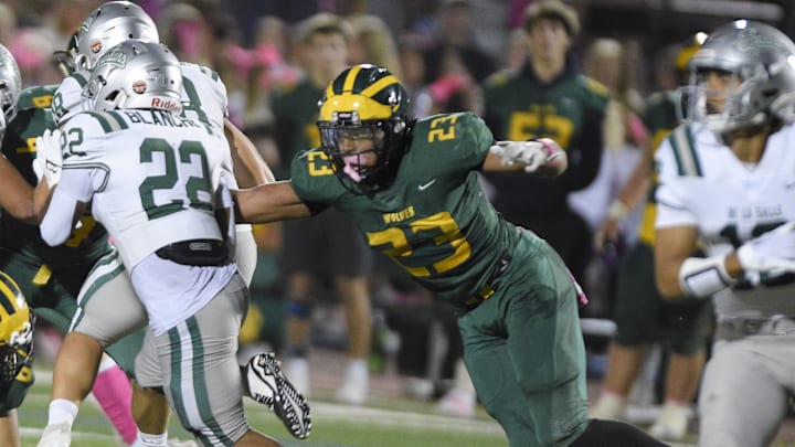 Marco Jones (23), the Bay Area's top recruit for 2025 from San Ramon Valley, takes down De La Salle's Derrick Blanche Jr., the region's No. 43 recruit. Jones leads a slew of stars who will take the field at Owen Owens Field in Concord Friday when San Ramon Valley visits De La Salle. 