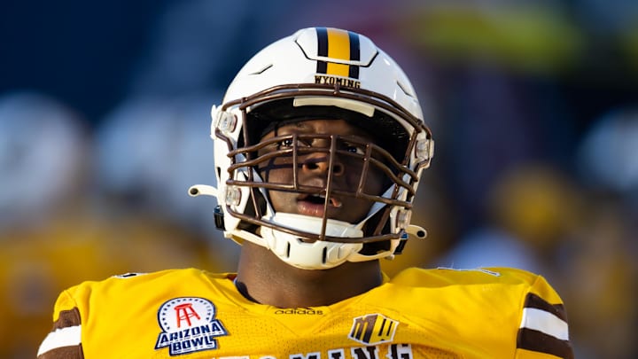 Dec 30, 2022; Tucson, AZ, USA; Wyoming Cowboys guard Emmanuel Pregnon (76) against the Ohio Bobcats during the 2022 Barstool Sports Arizona Bowl at Arizona Stadium.