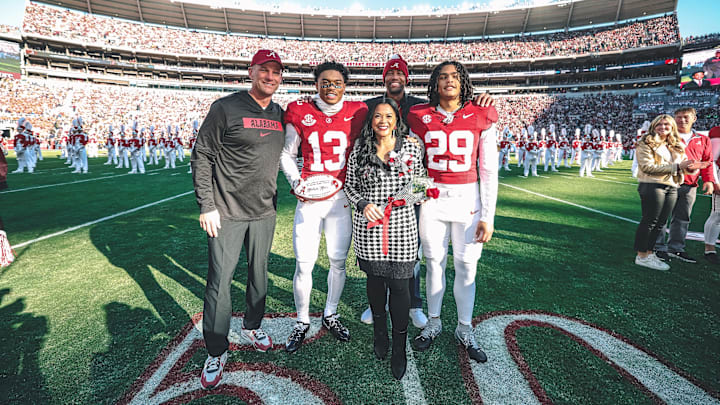 Kalen DeBoer with Malachi Moore's family on Senior Day Kalen DeBoer with Malachi Moore's family on Senior Day