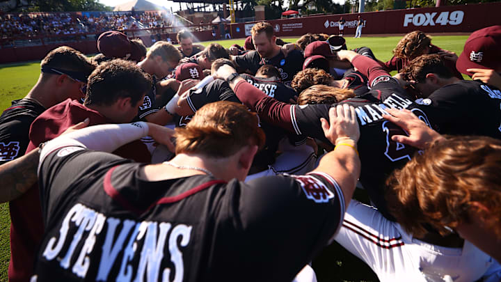 Mississippi State players huddle together before Saturday's NCAA Regional game against Florida State.