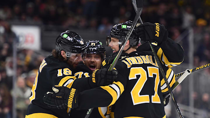 Mar 10, 2026; Boston, Massachusetts, USA; Boston Bruins center Pavel Zacha (18) left wing Viktor Arvidsson (71) defenseman Hampus Lindholm (27) celebrate a goal by defenseman Mason Lohrei (6) during the third period against the Los Angeles Kings at TD Garden. Mandatory Credit: Bob DeChiara-Imagn Images