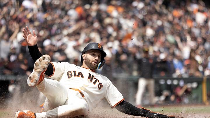 Apr 26, 2026; San Francisco, California, USA; San Francisco Giants designated hitter Casey Schmitt (10) slides safely home on an RBI double by Rafael Devers during the sixth inning against the Miami Marlins at Oracle Park. Mandatory Credit: D. Ross Cameron-Imagn Images