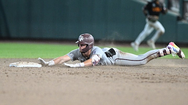 Jun 24, 2024; Omaha, NE, USA;  Texas A&M Aggies third baseman Gavin Grahovac (9) slides into second base with a double to lead off against the Tennessee Volunteers during the ninth inning at Charles Schwab Field Omaha. Mandatory Credit: Steven Branscombe-Imagn Images
