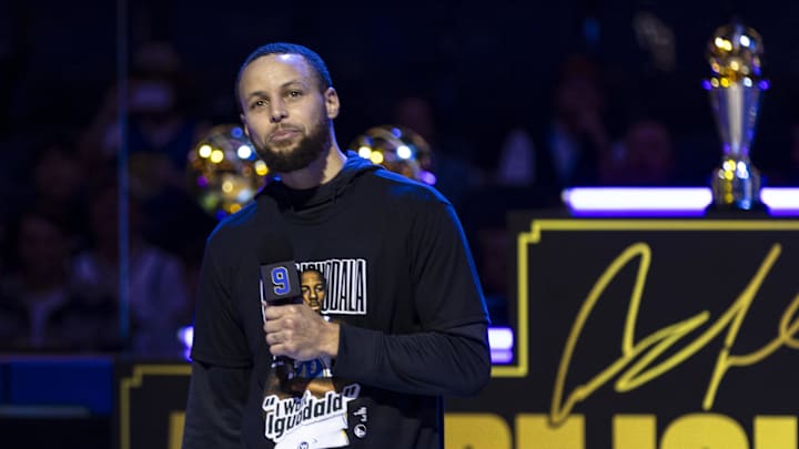 Golden State Warriors guard Stephen Curry (30) talks during the Andre Iguodala jersey retirement ceremony at Chase Center.