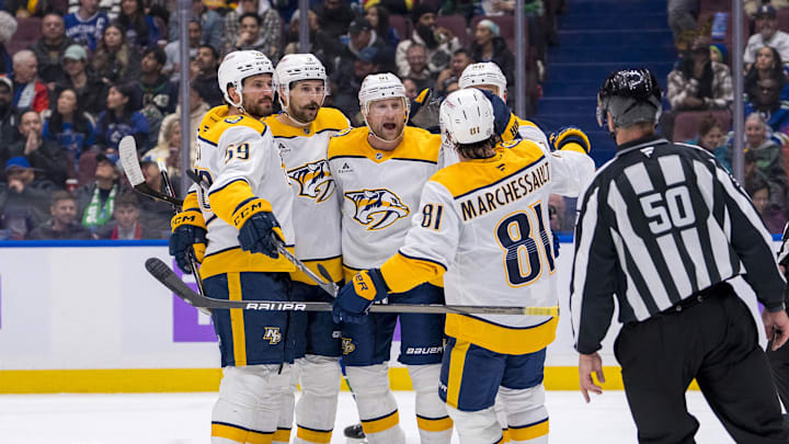 Nov 17, 2024; Vancouver, British Columbia, CAN; Dejected Vancouver Canucks forward Elias Pettersson (40) watches as Nashville Predators defenseman Roman Josi (59) and forward Filip Forsberg (9) and forward Steven Stamkos (91) and forward Ryan O'Reilly (90) and forward Jonathan Marchessault (81) celebrate Stamkos’ second goal against the Vancouver Canucks during the second period at Rogers Arena. Mandatory Credit: Bob Frid-Imagn Images
