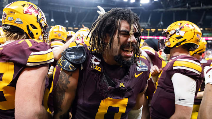 Dec 26, 2025; Phoenix, AZ, USA; Minnesota Golden Gophers defensive lineman Anthony Smith (0) celebrates after defeating the New Mexico Lobos in overtime during the Rate Bowl at Chase Field. Mandatory Credit: Mark J. Rebilas-Imagn Images