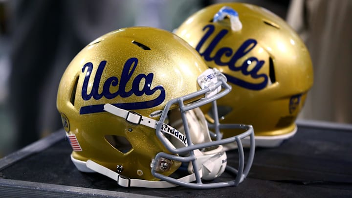 Sep 25, 2014; Tempe, AZ, USA; Detailed view of UCLA Bruins helmets on the sidelines against the