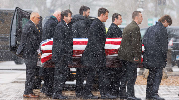 The casket of former Notre Dame football head coach Lou Holtz is carried into the Basilica of the Sacred Heart for his funeral service at the University of Notre Dame on Monday, March 16, 2026, in South Bend. Holtz died on March 4, 2026. The casket of former Notre Dame football head coach Lou Holtz is carried into the Basilica of the Sacred Heart for his funeral service at the University of Notre Dame on Monday, March 16, 2026, in South Bend. Holtz died on March 4, 2026.