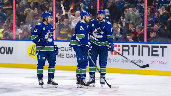 Nov 16, 2024; Vancouver, British Columbia, CAN; Vancouver Canucks defenseman Quinn Hughes (43) and forward Pius Suter (24) and forward J.T. Miller (9) celebrate a goal scored by Miller against the Chicago Blackhawks during the third period at Rogers Arena. Mandatory Credit: Bob Frid-Imagn Images