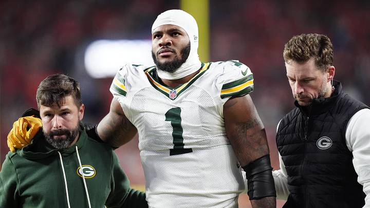 Dec 14, 2025; Denver, Colorado, USA; Green Bay Packers defensive end Micah Parsons (1) walks off the field with help from medical personnel following an injury during the third quarter against the Denver Broncos at Empower Field at Mile High. Mandatory Credit: Ron Chenoy-Imagn Images