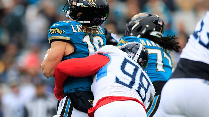Jacksonville Jaguars quarterback Trevor Lawrence (16) is sacked by Tennessee Titans defensive tackle Jeffery Simmons (98) during the first quarter of an NFL football matchup at EverBank Stadium, Sunday, Jan. 4, 2026, in Jacksonville, Fla. The Jaguars defeated the Titans 41-7, capturing the AFC South title. [Corey Perrine/Florida Times-Union]