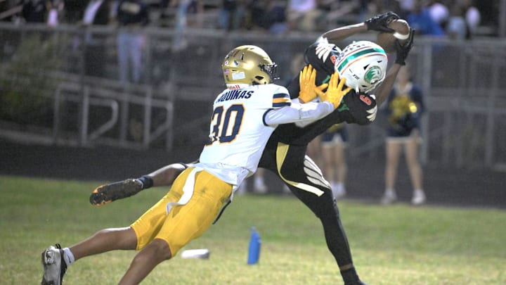 James Jones hauls in a catch during double OT of the regional championship against St. Thomas Aquinas. The pass was ruled incomplete because it was argued Jones did not get his foot in-bounds (Nov. 29, 2024).