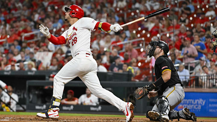 Sep 18, 2024; St. Louis, Missouri, USA;  St. Louis Cardinals third baseman Nolan Arenado (28) hits a one run single against the Pittsburgh Pirates during the third inning at Busch Stadium. Mandatory Credit: Jeff Curry-Imagn Images