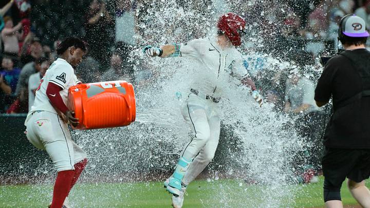 Sep 14, 2026; Phoenix, Arizona, USA; Arizona Diamondbacks right fielder Corbin Carroll (7) celebrates with shortstop Geraldo Perdomo (2) after hitting a walk off home run in the ninth inning
at Chase Field. Mandatory Credit: Matt Kartozian-Imagn Images Sep 14, 2026; Phoenix, Arizona, USA; Arizona Diamondbacks right fielder Corbin Carroll (7) celebrates with shortstop Geraldo Perdomo (2) after hitting a walk off home run in the ninth inning
at Chase Field. Mandatory Credit: Matt Kartozian-Imagn Images