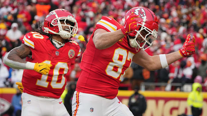 Jan 18, 2025; Kansas City, Missouri, USA; Kansas City Chiefs tight end Travis Kelce (87) celebrates with running back Isiah Pacheco (10) after making a long pass reception against the Houston Texans during the second quarter of a 2025 AFC divisional round game at GEHA Field at Arrowhead Stadium.