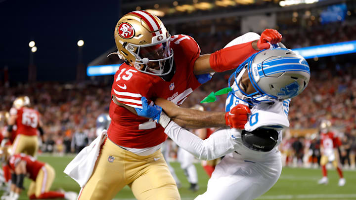 Dec 30, 2024; Santa Clara, California, USA; San Francisco 49ers wide receiver Jauan Jennings (15) and Detroit Lions cornerback Terrion Arnold (0) get tangled after a play during the first quarter at Levi's Stadium. Mandatory Credit: Sergio Estrada-Imagn Images