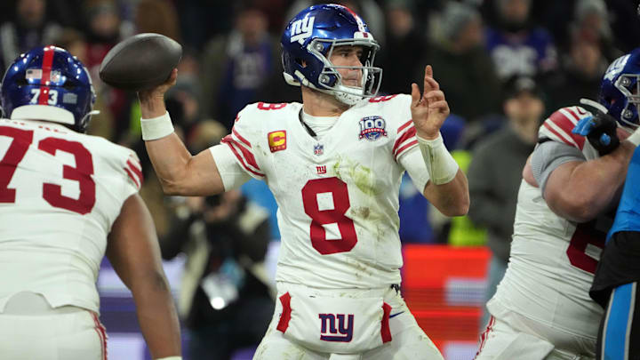 Nov 10, 2024; Munich, Germany; New York Giants quarterback Daniel Jones (8) throws the ball against the Carolina Panthers  in the second half during the 2024 NFL Munich Game at Allianz Arena. Mandatory Credit: Kirby Lee-Imagn Images