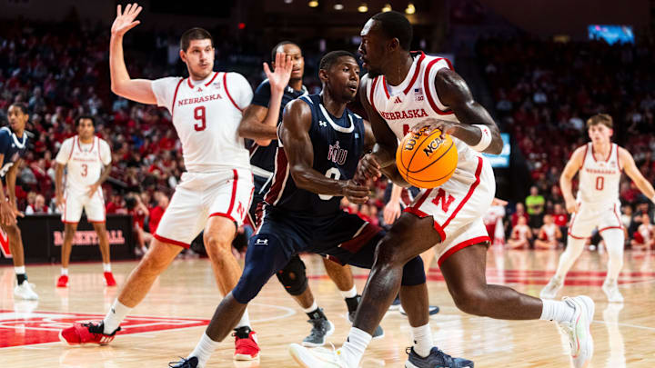 Nov 13, 2024; Lincoln, Nebraska, USA; Nebraska Cornhuskers forward Juwan Gary (4) drives against Fairleigh Dickinson Knights guard Ahmed Barba-Bey (8) during the first half at Pinnacle Bank Arena.