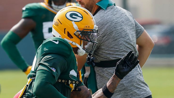 Green Bay Packers lineback Isaiah Simmons runs through a drill at training camp.