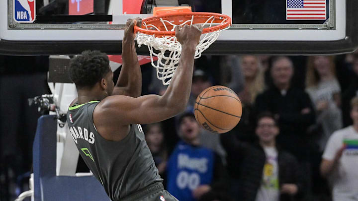 Jan 14, 2023; Minneapolis, Minnesota, USA; Minnesota Timberwolves guard Anthony Edwards (1) completes a slam dunk over Cleveland Cavaliers guard Donovan Mitchell (45)during the first quarter at Target Center. Mandatory Credit: Jeffrey Becker-Imagn Images Jan 14, 2023; Minneapolis, Minnesota, USA; Minnesota Timberwolves guard Anthony Edwards (1) completes a slam dunk over Cleveland Cavaliers guard Donovan Mitchell (45)during the first quarter at Target Center. Mandatory Credit: Jeffrey Becker-Imagn Images